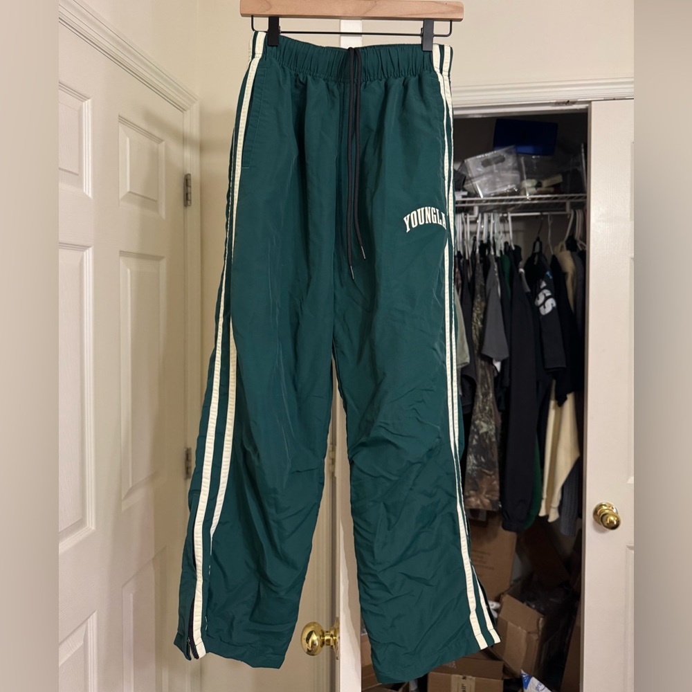 Green Track Pants with White Side Stripes
